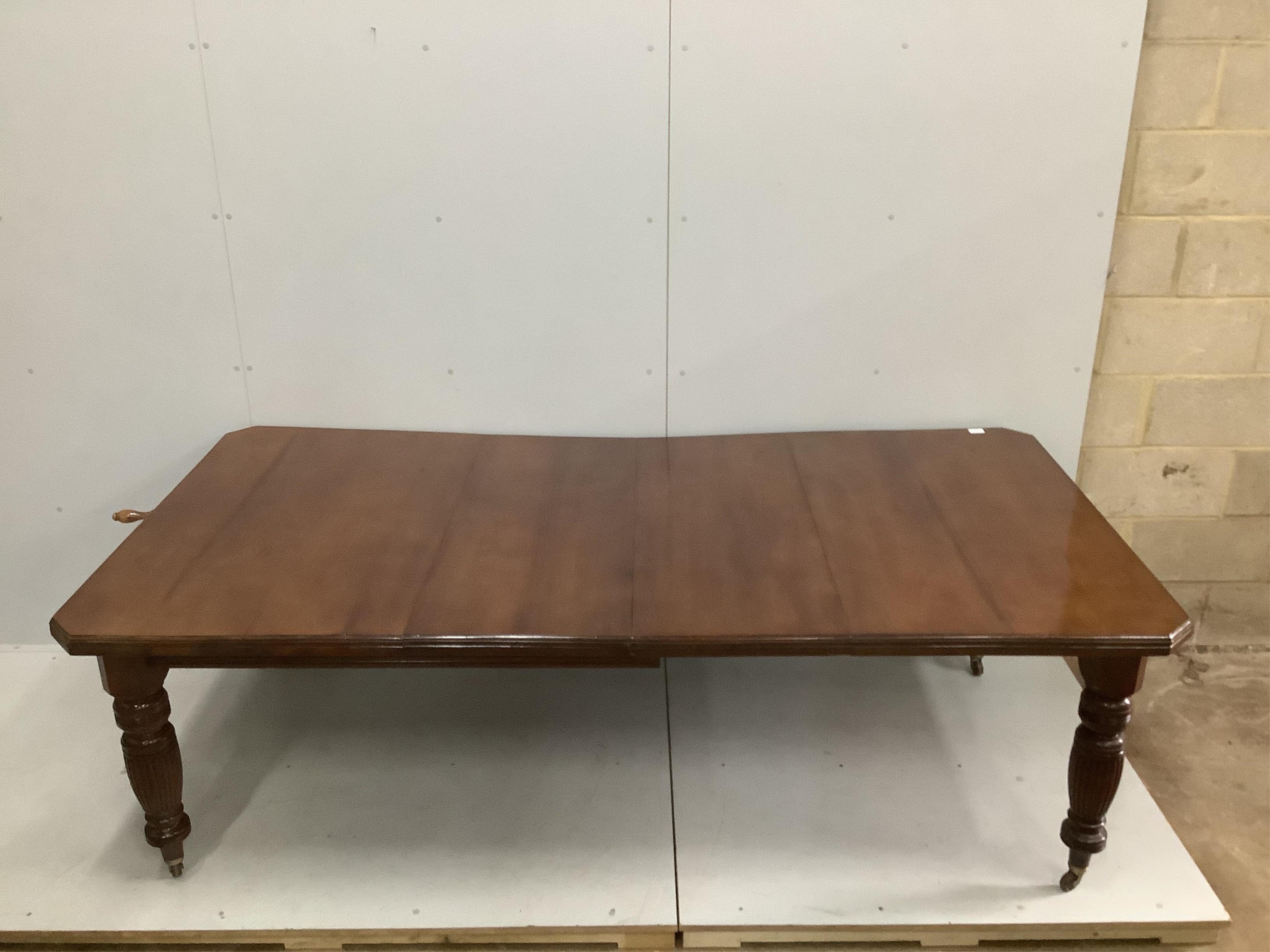 A late Victorian walnut extending dining table, width 232cm extended, two spare leaves, depth 118cm, height 73cm. Condition - good